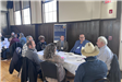 Group at a Table Having a Discussion at the Economic Development Summit