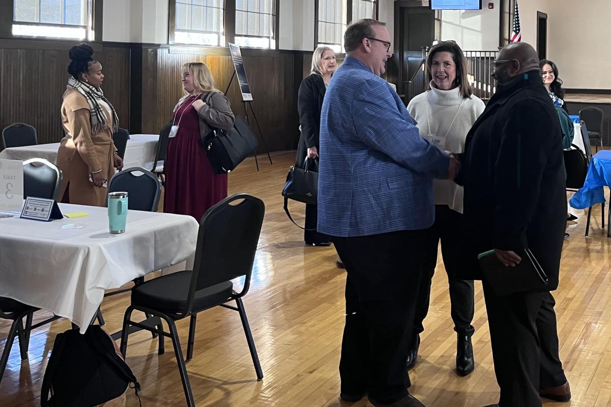 Groups of People Talking at the Economic Development Summit